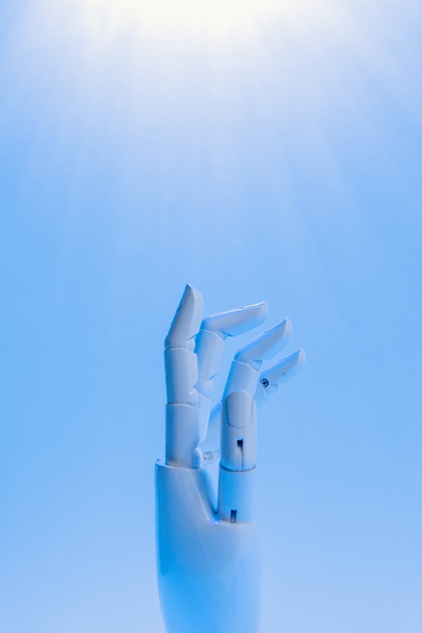robot s hand on blue background